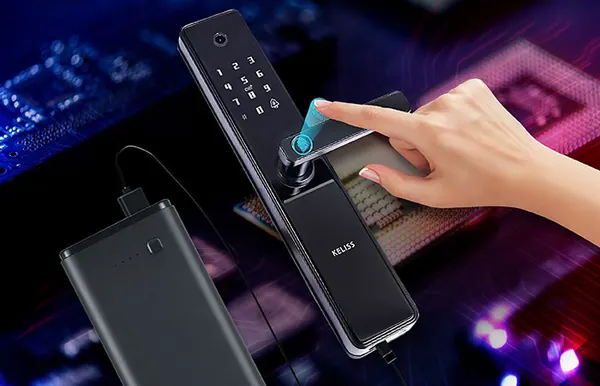 Power bank connected to a smart lock while a finger touches the fingerprint reader