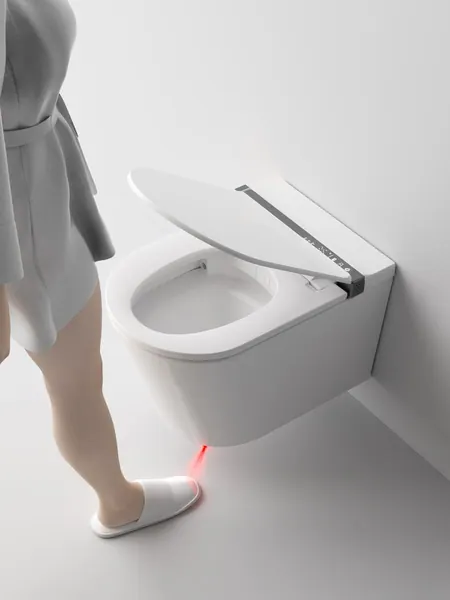 Lid of a smart toilet opening as a person approaches